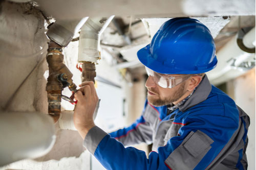 Miramar commercial plumbing technician inspecting pipes